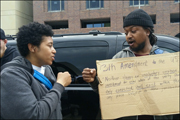 Charina Austin talks with a fellow Baltimore resident during a May 2, 2015, protest of police brutality in Baltimore.