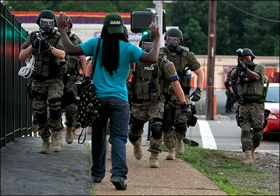 Heavily armed police in Ferguson, Mo., in August 2014 (AP Photo/Jeff Roberson)