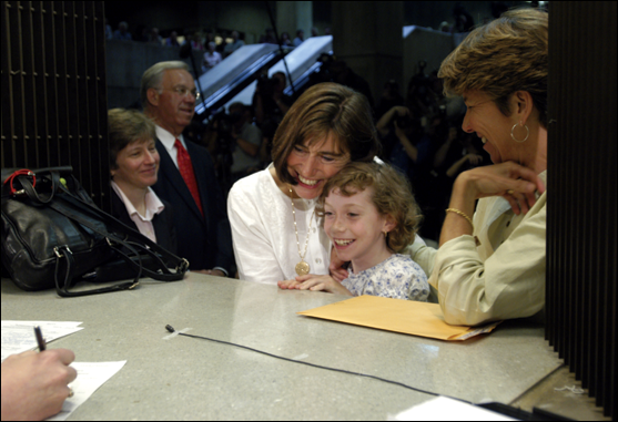 Julie and Hillary Goodridge, accompanied by their daughter, Annie, register to marry at Boston City Hall on May 17, 2004, as Mary Bonauto, their lawyer, and Mayor Thomas Menino look on