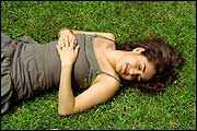 young woman on grass (Elizabeth Shoemaker/iStockphoto)